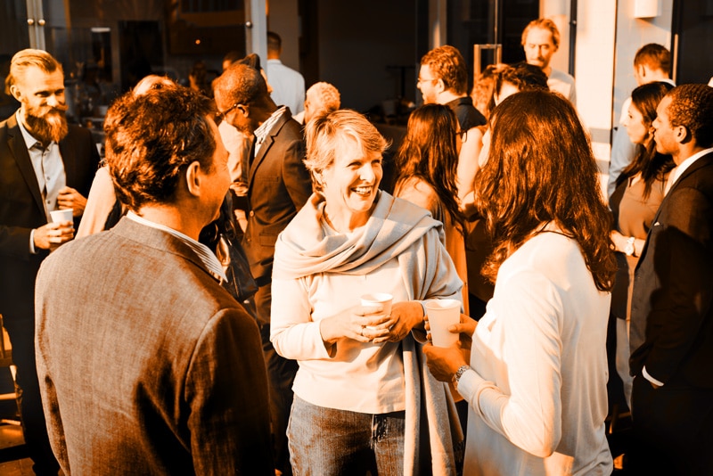 Event attendees networking at an annual corporate event