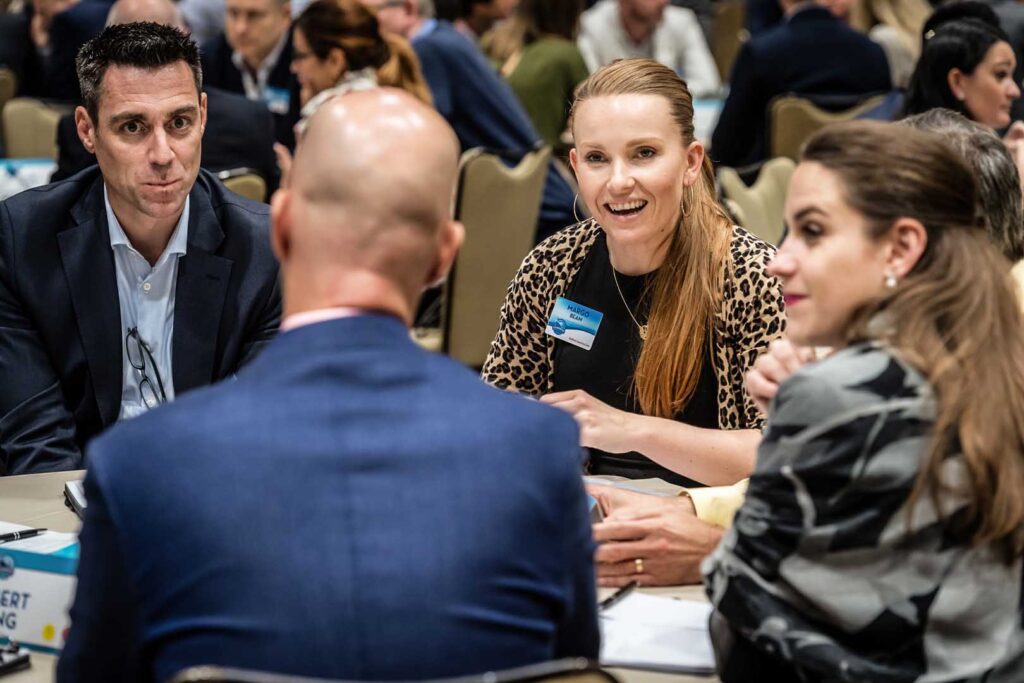 group of people interacting at a corporate event